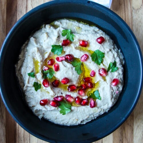 Mutabbal eggplant dip in a black dish.